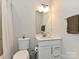 Elegant bathroom featuring a vanity with contemporary fixtures and a toilet at 417 Tristram Ln, Charlotte, NC 28205