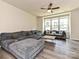 Bright living room with large windows and a sectional sofa at 417 Tristram Ln, Charlotte, NC 28205