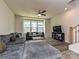 A bright living room featuring a TV, windows, and a comfortable couch at 417 Tristram Ln, Charlotte, NC 28205