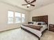 Primary bedroom with decorative headboard and large windows at 417 Tristram Ln, Charlotte, NC 28205