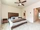 Comfortable primary bedroom with carpet, ceiling fan, and ensuite bath at 417 Tristram Ln, Charlotte, NC 28205
