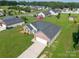 Charming brick home featuring a two-car garage and lush green lawn, ideal for suburban living at 4193 He Propst Rd, Maiden, NC 28650