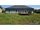 Backyard view of the house with a wood deck and a lawn at 4193 He Propst Rd, Maiden, NC 28650
