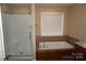 Bathroom featuring a large tub and separate shower at 4193 He Propst Rd, Maiden, NC 28650