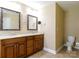 The bathroom features double sinks with wood cabinets, decorative mirrors, and a separate toilet at 4193 He Propst Rd, Maiden, NC 28650