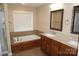 Bathroom featuring dual sinks with a tub at 4193 He Propst Rd, Maiden, NC 28650