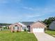 Charming brick and gray home featuring a two-car garage and manicured front lawn in a suburban setting at 4193 He Propst Rd, Maiden, NC 28650