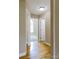 Hallway featuring hardwood floors, neutral paint, and doorway views into other rooms at 4193 He Propst Rd, Maiden, NC 28650