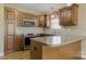 Kitchen with granite countertops, stainless steel appliances and custom wood cabinets at 4193 He Propst Rd, Maiden, NC 28650