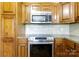 Well-equipped kitchen with stainless steel appliances and dark wooden cabinets at 4193 He Propst Rd, Maiden, NC 28650