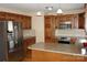 Well-equipped kitchen with stainless steel appliances, custom cabinets, and granite countertops at 4193 He Propst Rd, Maiden, NC 28650