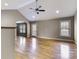 Open living room featuring hardwood floors, neutral walls, ceiling fan, and an arched doorway at 4193 He Propst Rd, Maiden, NC 28650