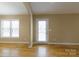 Bright and airy living room with hardwood floors, a large window, and a glass-paneled door at 4193 He Propst Rd, Maiden, NC 28650