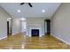 Living room with fireplace, hardwood floors, neutral walls and archways to other rooms at 4193 He Propst Rd, Maiden, NC 28650