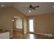 Bright living room with hardwood floors, neutral walls, and a ceiling fan for added comfort at 4193 He Propst Rd, Maiden, NC 28650