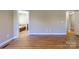 Spacious primary bedroom with hardwood floors leading to a bathroom with a soaking tub at 4193 He Propst Rd, Maiden, NC 28650