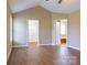 Spacious primary bedroom with hardwood floors and walk-in closet leading to primary bathroom at 4193 He Propst Rd, Maiden, NC 28650