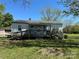 Charming exterior elevation with a ramp, deck, and a well-maintained yard at 5364 Millersville Rd, Taylorsville, NC 28681