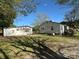 A full property view, showing the house and the detached garage with a large yard at 5364 Millersville Rd, Taylorsville, NC 28681