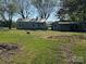 Cottage-style home with a storage garage and large yard at 5364 Millersville Rd, Taylorsville, NC 28681