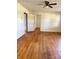 Spacious living room featuring hardwood floors and a ceiling fan at 5364 Millersville Rd, Taylorsville, NC 28681