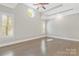 Bright, open bedroom with hardwood floors, tray ceiling and recessed lighting at 5538 Camelot Dr, Charlotte, NC 28270