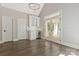 Sitting area with white cabinetry, beverage fridge, and glass doors leading to an outdoor patio at 5538 Camelot Dr, Charlotte, NC 28270