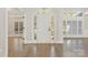 View of the foyer and front door with decorative glass, with hardwood flooring and large windows at 5538 Camelot Dr, Charlotte, NC 28270