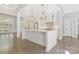 Open-concept kitchen with a large island, modern appliances, and stylish pendant lighting fixtures at 5538 Camelot Dr, Charlotte, NC 28270
