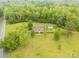 Overhead shot showcasing this home, detached garage and its vast green space surrounded by lush forest at 5840 Shirley Rd, Fort Lawn, SC 29714