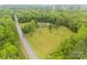 Aerial view of the property showcasing its location, large lawn, and surrounding lush trees at 5840 Shirley Rd, Fort Lawn, SC 29714