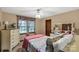 Cozy bedroom with a ceiling fan, window, dresser and comfortable furnishings at 5840 Shirley Rd, Fort Lawn, SC 29714