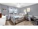 This bedroom features light-gray walls and trim and soft natural light at 5840 Shirley Rd, Fort Lawn, SC 29714