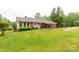 Well-kept home exterior with lush green lawn and inviting covered porch at 5840 Shirley Rd, Fort Lawn, SC 29714