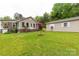 Charming home exterior with well-manicured lawn and detached garage at 5840 Shirley Rd, Fort Lawn, SC 29714