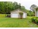 Detached two-car garage nestled on a lush green lawn with mature trees at 5840 Shirley Rd, Fort Lawn, SC 29714
