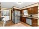 This kitchen features wood cabinetry, stainless steel appliances, and granite countertops at 5840 Shirley Rd, Fort Lawn, SC 29714