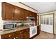 This kitchen boasts wood cabinetry, granite countertops, and modern appliances at 5840 Shirley Rd, Fort Lawn, SC 29714