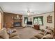 Comfortable living room with a brick fireplace, plush seating, and lots of natural light at 5840 Shirley Rd, Fort Lawn, SC 29714