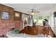 A sun-drenched living room with hardwood floors and brick accents at 5840 Shirley Rd, Fort Lawn, SC 29714