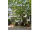 Lovely townhomes with inviting entrances, covered porches, and verdant landscaping at 627 N Alexander St, Charlotte, NC 28202