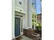 Exterior front entrance with gray door, address number, and landscaped greenery at 627 N Alexander St, Charlotte, NC 28202