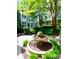 Charming courtyard with lush greenery and a fountain in front of the townhomes at 627 N Alexander St, Charlotte, NC 28202