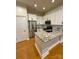 Modern kitchen features stainless steel appliances, granite countertops and white cabinetry at 627 N Alexander St, Charlotte, NC 28202