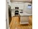 Modern kitchen features stainless steel appliances, granite countertops and white cabinetry at 627 N Alexander St, Charlotte, NC 28202