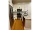Modern kitchen features stainless steel appliances, granite countertops and white cabinetry at 627 N Alexander St, Charlotte, NC 28202