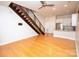 Bright living room features hardwood floors, a staircase, and access to the kitchen at 627 N Alexander St, Charlotte, NC 28202