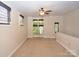 Upstairs bonus room includes multiple windows for ample natural light at 627 N Alexander St, Charlotte, NC 28202