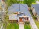 Aerial view of charming home with inviting front porch and manicured front yard at 705 N Fulton St, Salisbury, NC 28144