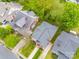 Aerial view of home on tree lined street with large yard and driveway access at 705 N Fulton St, Salisbury, NC 28144
